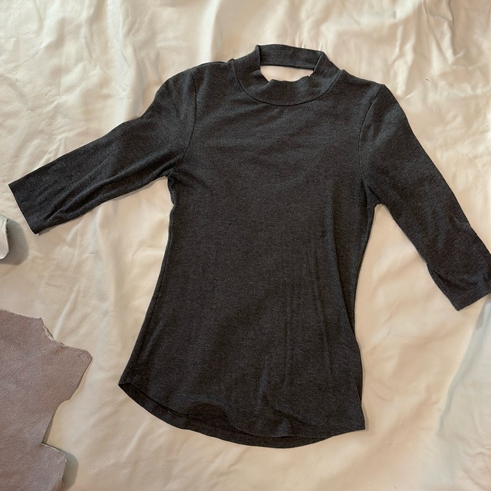 Grey body skimming sweater with back cut out